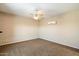 Bright bedroom with ceiling fan and carpet flooring at 9255 W Buckskin Trl, Peoria, AZ 85383