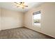 Bright bedroom with carpet and a window at 9255 W Buckskin Trl, Peoria, AZ 85383