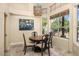 Cozy breakfast nook with a round table and large windows at 9255 W Buckskin Trl, Peoria, AZ 85383