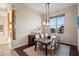 Elegant dining room with wood table and large windows at 9255 W Buckskin Trl, Peoria, AZ 85383