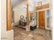 Elegant entryway with tile flooring, wood columns, and a view into the dining area at 9255 W Buckskin Trl, Peoria, AZ 85383