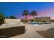 Hot tub near a refreshing blue pool at sunset at 9255 W Buckskin Trl, Peoria, AZ 85383