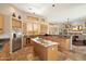 Large kitchen with island and stainless steel appliances at 9255 W Buckskin Trl, Peoria, AZ 85383