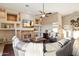 Open concept living room with stone fireplace at 9255 W Buckskin Trl, Peoria, AZ 85383