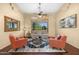 Bright and airy living room featuring comfortable seating and a large window at 9255 W Buckskin Trl, Peoria, AZ 85383