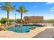 Relaxing backyard pool with palm trees and lounge chairs at 9255 W Buckskin Trl, Peoria, AZ 85383