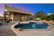 Stunning pool and spa with outdoor lighting at dusk at 9255 W Buckskin Trl, Peoria, AZ 85383