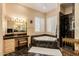 Elegant bathroom with corner bathtub, double sinks, and a separate shower at 928 E Valencia Dr, Phoenix, AZ 85042