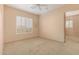 Bright bedroom with ceiling fan and large windows at 928 E Valencia Dr, Phoenix, AZ 85042