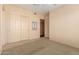 Spacious bedroom with mirrored closet doors and neutral decor at 928 E Valencia Dr, Phoenix, AZ 85042