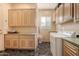 Bright laundry room with built-in cabinets and washer/dryer at 928 E Valencia Dr, Phoenix, AZ 85042