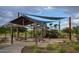 Wooden playground structure with shade cover at 9343 W Cashman Dr, Peoria, AZ 85383