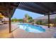 Relaxing pool area with pergola and patio furniture at 9343 W Cashman Dr, Peoria, AZ 85383