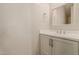 Simple bathroom with white vanity and a mirror at 9430 W Jj Ranch Rd, Peoria, AZ 85383