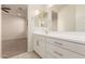 Clean bathroom with double vanity and access to bedroom at 9430 W Jj Ranch Rd, Peoria, AZ 85383