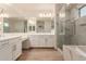 Modern bathroom boasting double sinks, a soaking tub and a walk-in shower at 9430 W Jj Ranch Rd, Peoria, AZ 85383