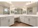 Double vanity bathroom with modern finishes and a large mirror at 9430 W Jj Ranch Rd, Peoria, AZ 85383