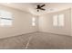 Bright bedroom with ceiling fan and large windows at 9430 W Jj Ranch Rd, Peoria, AZ 85383