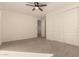 Light and airy bedroom with ceiling fan and double doors at 9430 W Jj Ranch Rd, Peoria, AZ 85383