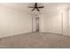 Spacious bedroom with double closets and ceiling fan at 9430 W Jj Ranch Rd, Peoria, AZ 85383