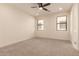 Bright bedroom with ceiling fan and two windows at 9430 W Jj Ranch Rd, Peoria, AZ 85383