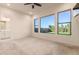 Bedroom with backyard views and ceiling fan at 9430 W Jj Ranch Rd, Peoria, AZ 85383