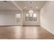 Bright dining room with hardwood floors and modern light fixture at 9430 W Jj Ranch Rd, Peoria, AZ 85383