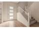 Bright entryway with staircase and wood-look tile floors at 9430 W Jj Ranch Rd, Peoria, AZ 85383