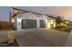 Spacious three-car garage with paver driveway at 9430 W Jj Ranch Rd, Peoria, AZ 85383