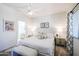 Bright bedroom with king-size bed and ensuite bathroom access at 9455 E Raintree Dr # 2049, Scottsdale, AZ 85260