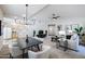 Open concept dining area with black table and white chairs, adjacent to kitchen at 9455 E Raintree Dr # 2049, Scottsdale, AZ 85260