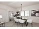 Elegant dining room with a black table and white chairs at 9455 E Raintree Dr # 2049, Scottsdale, AZ 85260