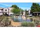 Community fountain with landscaping and building view at 9455 E Raintree Dr # 2049, Scottsdale, AZ 85260