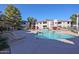 Community pool with lounge chairs at 9455 E Raintree Dr # 2049, Scottsdale, AZ 85260