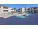 Community pool and spa with ample deck space for relaxing at 9455 E Raintree Dr # 2049, Scottsdale, AZ 85260