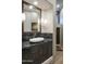 Modern bathroom with floating sink and dark granite countertop at 10040 E Happy Valley Rd # 1041, Scottsdale, AZ 85255