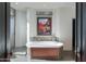 Spa-like bathroom with large soaking tub and picture window at 10040 E Happy Valley Rd # 1041, Scottsdale, AZ 85255