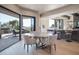 Casual dining area with a round table and chairs, adjacent to the kitchen and patio at 10040 E Happy Valley Rd # 1041, Scottsdale, AZ 85255