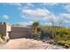 Stunning desert landscape surrounds this contemporary home with a large, inviting driveway at 10040 E Happy Valley Rd # 1041, Scottsdale, AZ 85255