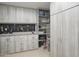 Organized garage with built-in storage and workbench at 10040 E Happy Valley Rd # 1041, Scottsdale, AZ 85255