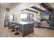 Modern kitchen with large island, ample counter space, and views to the living room at 10040 E Happy Valley Rd # 1041, Scottsdale, AZ 85255