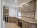 Laundry room with custom cabinetry, granite countertops, and a workspace at 10040 E Happy Valley Rd # 1041, Scottsdale, AZ 85255