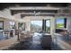 Open living space with a fireplace, large windows, and plenty of natural light at 10040 E Happy Valley Rd # 1041, Scottsdale, AZ 85255
