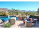 Relaxing pool with patio seating and breathtaking mountain views at 10040 E Happy Valley Rd # 1041, Scottsdale, AZ 85255