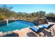 Inviting swimming pool with lounge chairs, offering scenic mountain views at 10040 E Happy Valley Rd # 1041, Scottsdale, AZ 85255