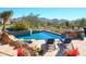 Stunning pool and spa with mountain backdrop, perfect for relaxation at 10040 E Happy Valley Rd # 1041, Scottsdale, AZ 85255