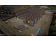 An aerial view of a backyard featuring a covered patio, outdoor seating and storage shed at 10062 W Redbird Rd, Peoria, AZ 85383