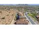 Aerial view showcasing neighborhood homes and landscape at 10062 W Redbird Rd, Peoria, AZ 85383