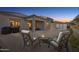Relaxing backyard patio area with a fire pit, seating, and outdoor grill at 10062 W Redbird Rd, Peoria, AZ 85383