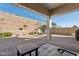 Relaxing backyard patio with fire pit and seating area at 10062 W Redbird Rd, Peoria, AZ 85383